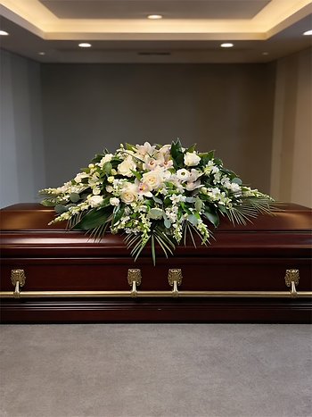 Remembered in Peace Casket Spray